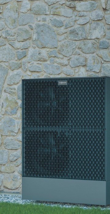 Die Wärmepumpe von Viessmann für Einfamilienhäuser. Im Vordergrund steht die Außeneinheit der Wärmepumpe, im Hintergrund die Inneneinheit.